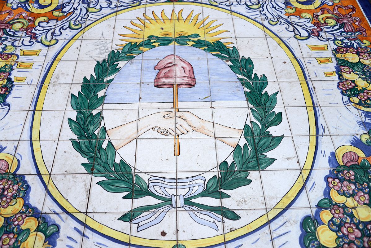 11-11 Tiled Image In Mendoza Plaza Espana of The Coat Of Ams Of Argentina The Sun Overlooking Two Hands Shaking